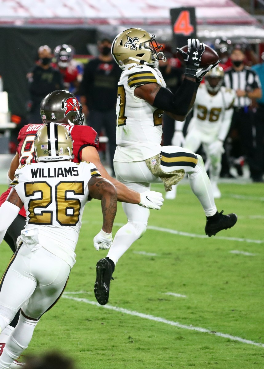 New Orleans Saints strong safety Malcolm Jenkins (27) intercepts the ball against the Tampa Bay Buccaneers. Mandatory Credit: Kim Klement-USA TODAY 
